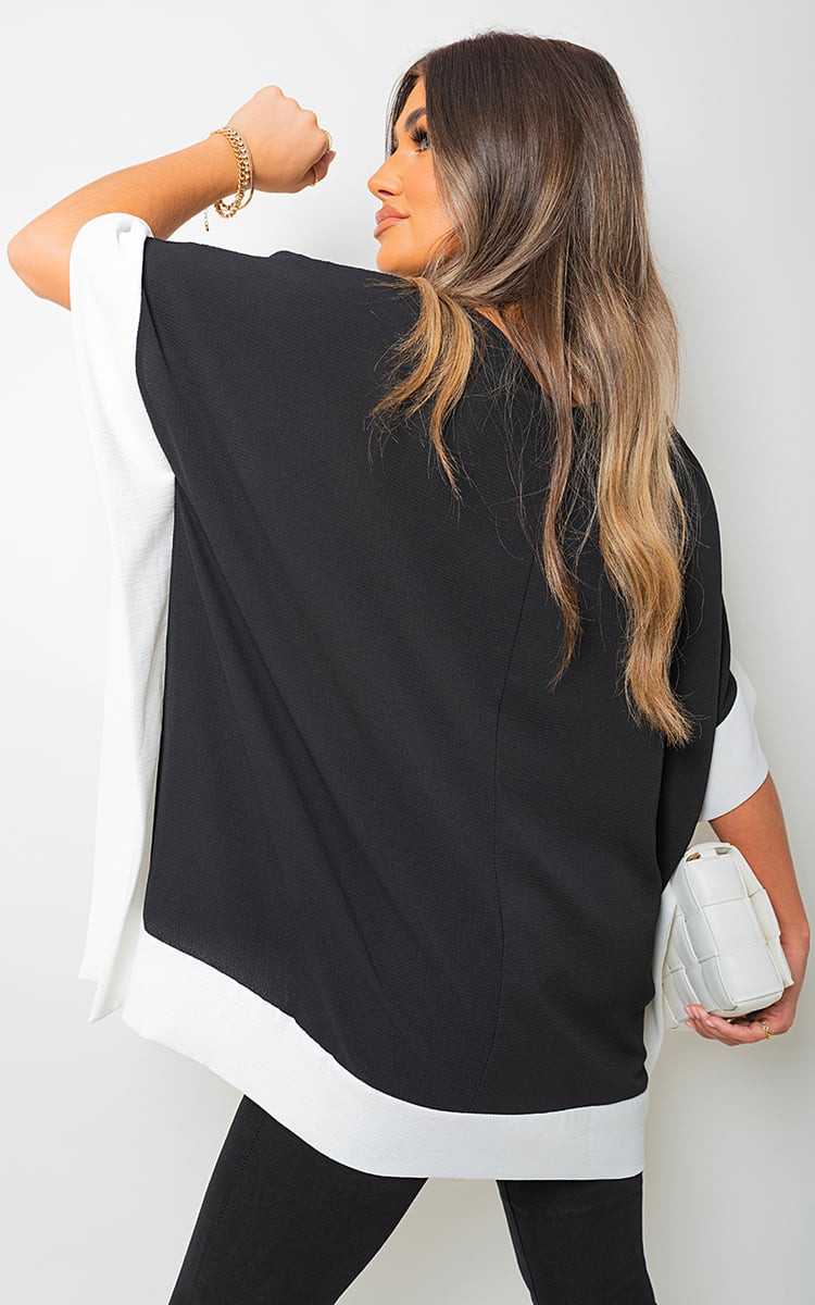 LAURA Oversized Contrast Hem Flare Sleeve Top